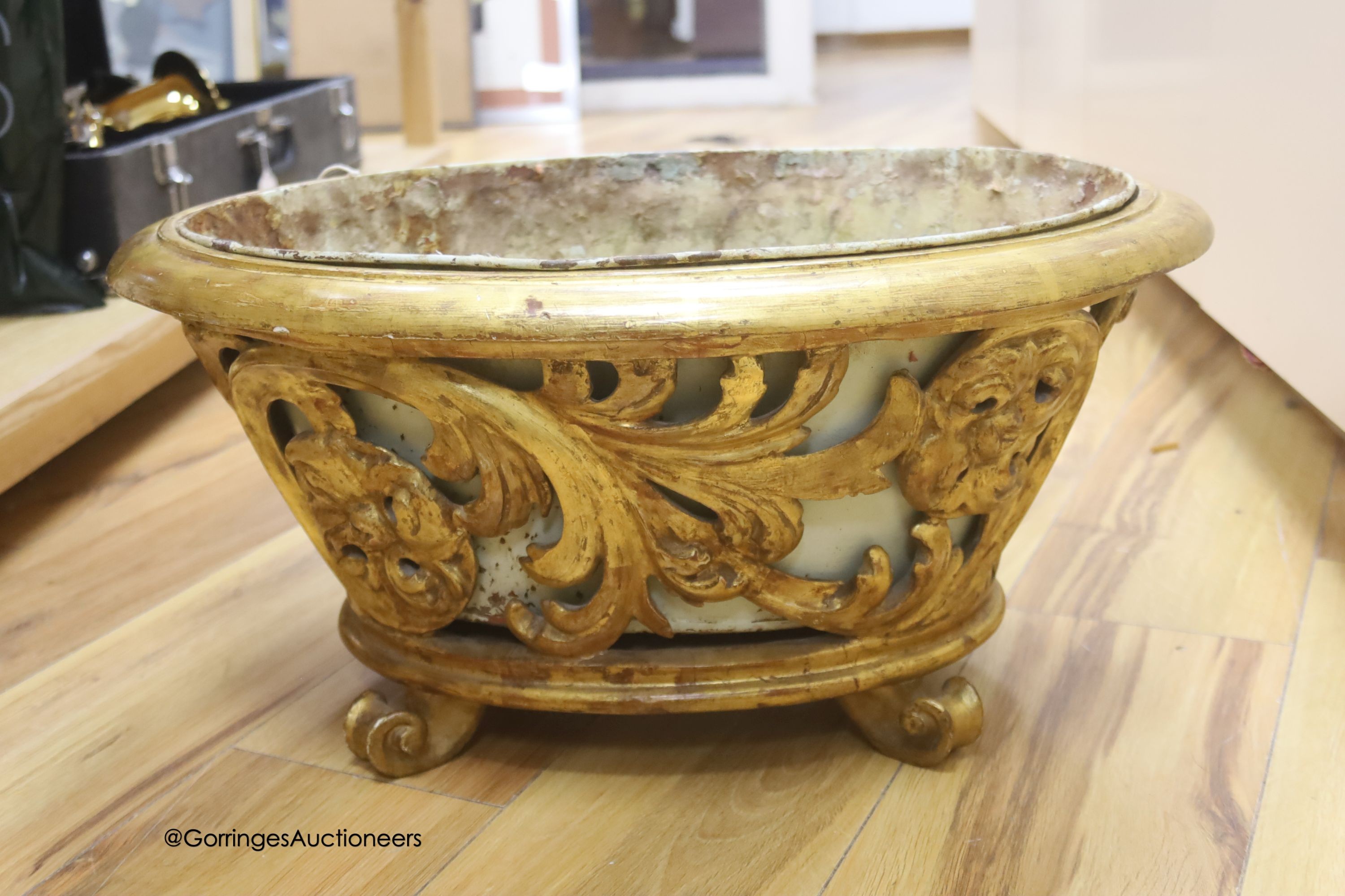 A carved wood and giltwood jardiniere, metal liner, length 54cm